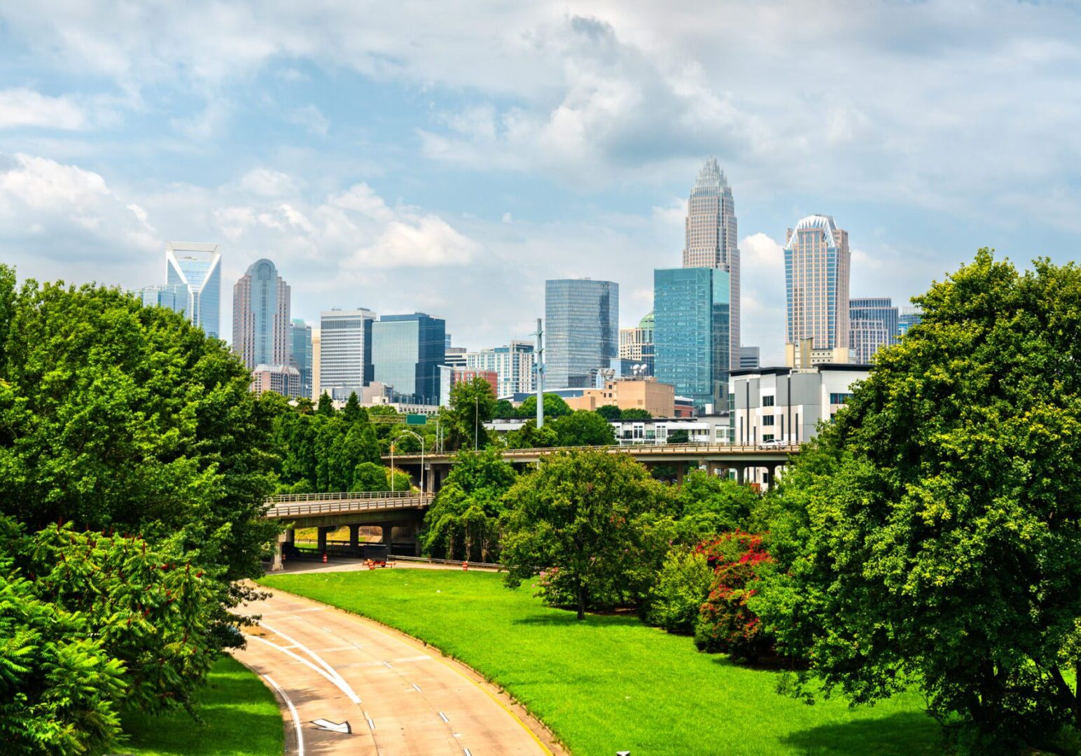 City skyline with lush park foreground.
